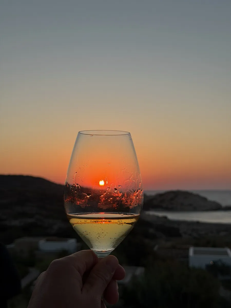 The sunset caught in a glass of white wine